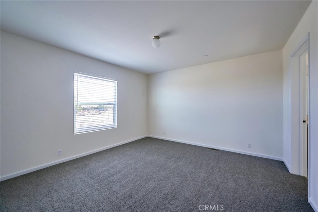 11475 Descanso Road Pinon Hills, CA 92372 - Photo 17 of 35 an empty room with a window