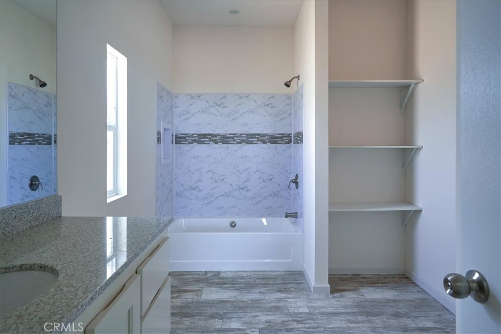 11475 Descanso Road Pinon Hills, CA 92372 - Photo 21 of 35 a bathroom with a bathtub and a shower