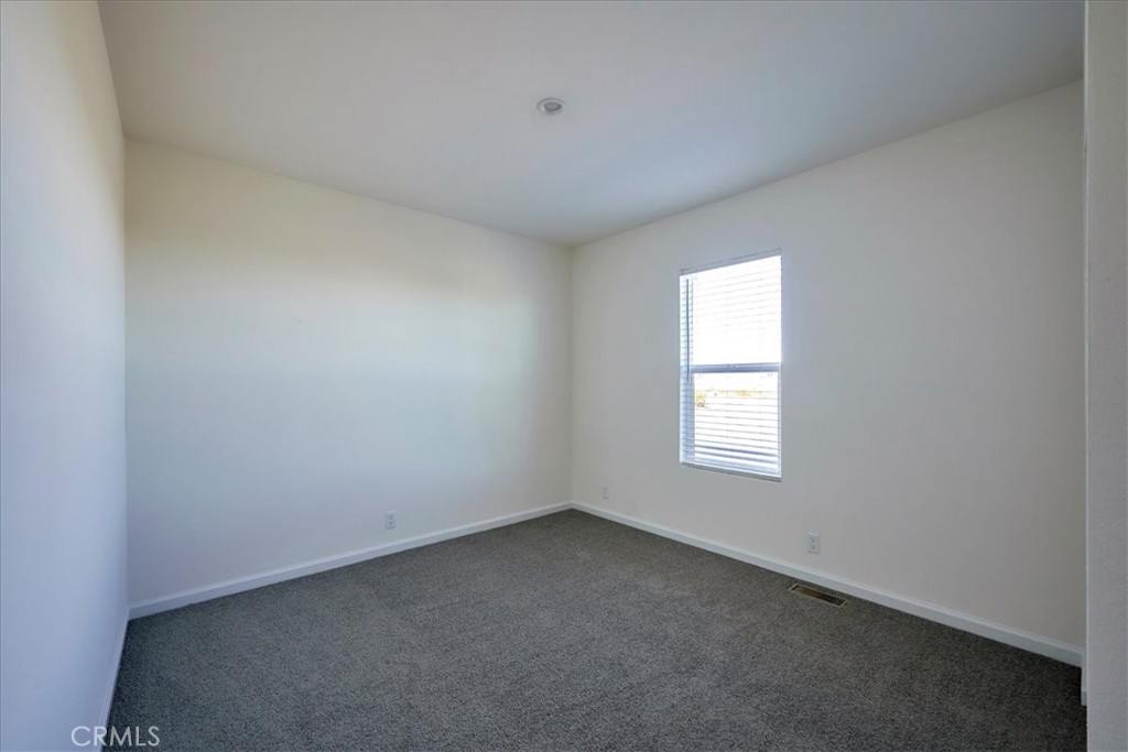 11475 Descanso Road Pinon Hills, CA 92372 - Photo 24 of 35 an empty room with a window
