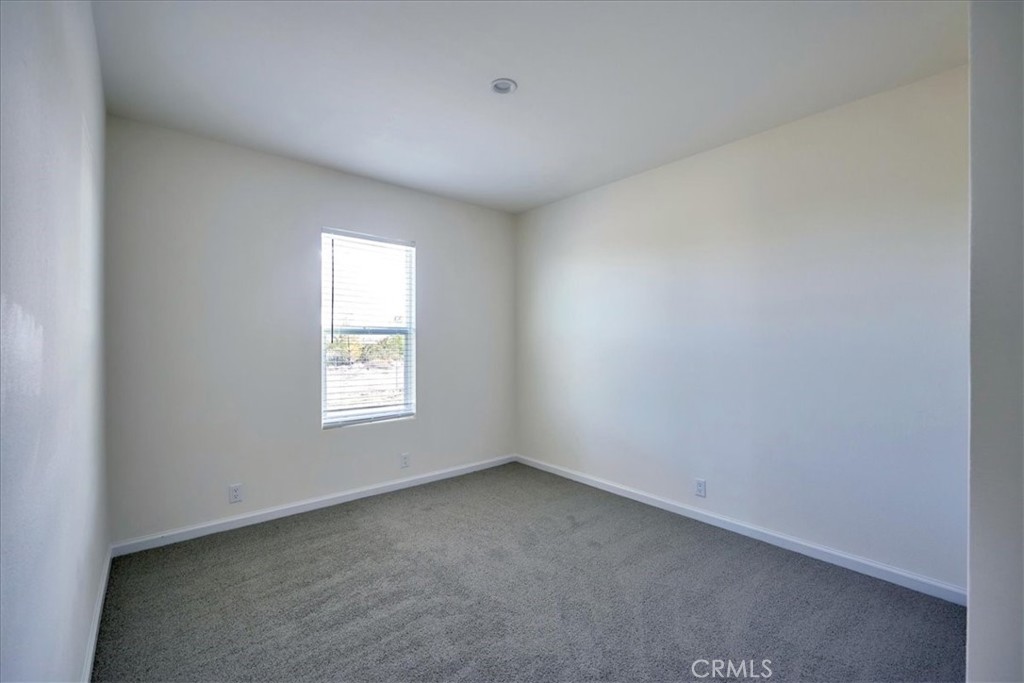 11475 Descanso Road Pinon Hills, CA 92372 - Photo 29 of 35 an empty room with a window
