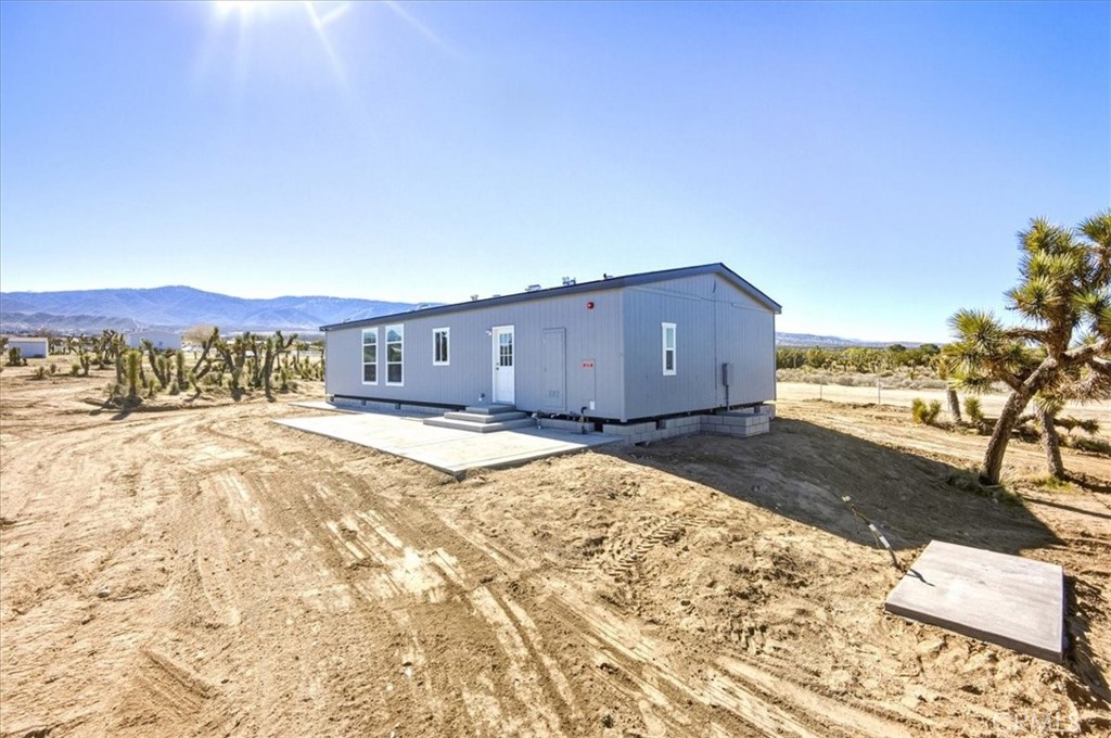 11475 Descanso Road Pinon Hills, CA 92372 - Photo 31 of 35 a view of a house with a yard