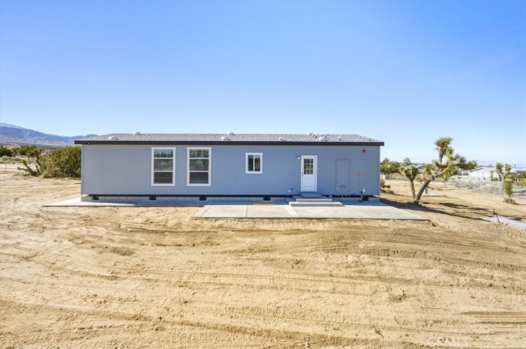 11475 Descanso Road Pinon Hills, CA 92372 - Photo 34 of 35 a view of a house with a backyard