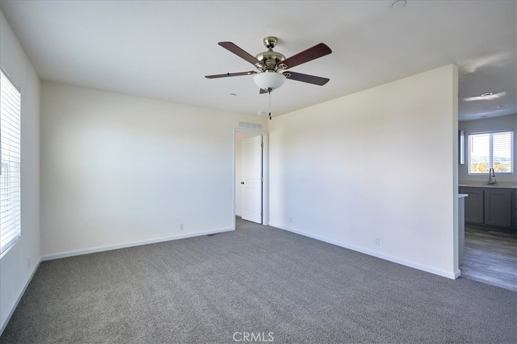 11475 Descanso Road Pinon Hills, CA 92372 - Photo 6 of 35 an empty room with closet and windows