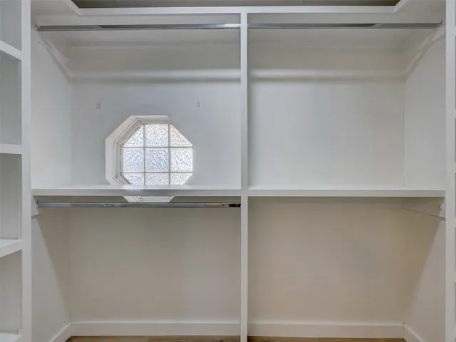 a bathroom with a double vanity sink and mirror
