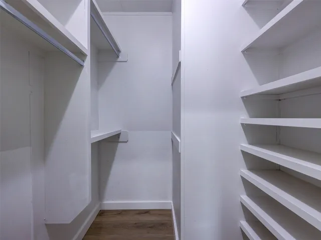 a bathroom with a double vanity sink toilet and shower