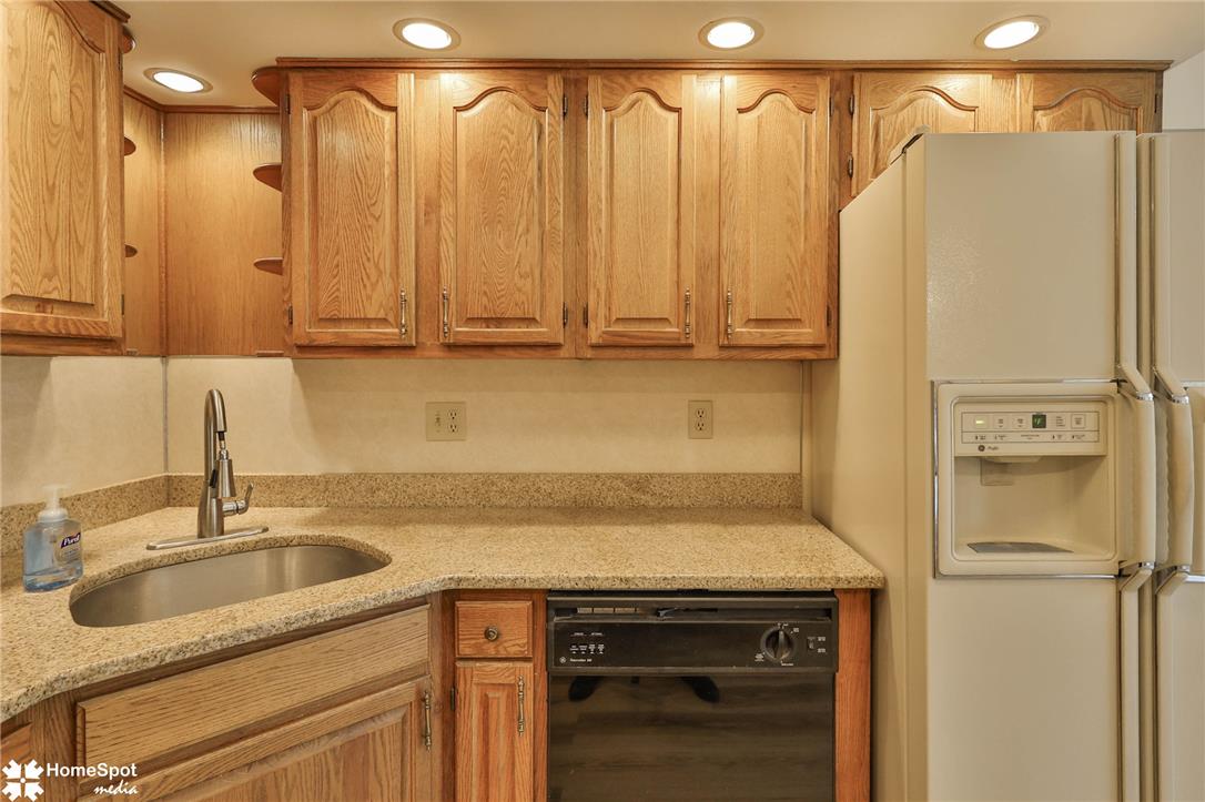4059 Wedgewood Road Allentown, PA 18104 - Photo 19 of 72 Functional kitchen with ample cabinet space, a convenient corner sink, and modern appliances.