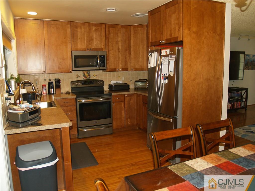 504 A Belford Road, Unit A Monroe Township, NJ 08831 - Photo 17 of 42 a kitchen with a sink appliances and cabinets