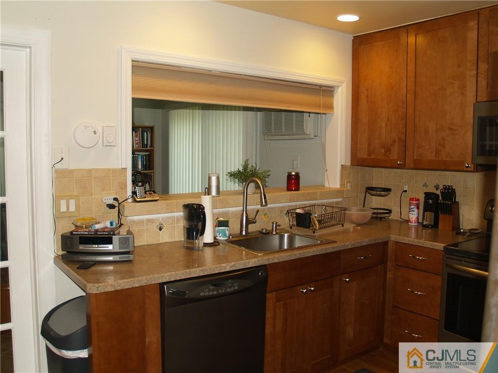 504 A Belford Road, Unit A Monroe Township, NJ 08831 - Photo 18 of 42 a kitchen with a sink and cabinets
