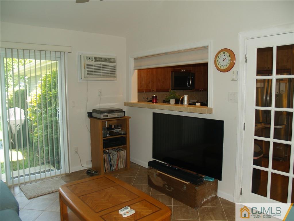504 A Belford Road, Unit A Monroe Township, NJ 08831 - Photo 20 of 42 a living room with furniture and a flat screen tv