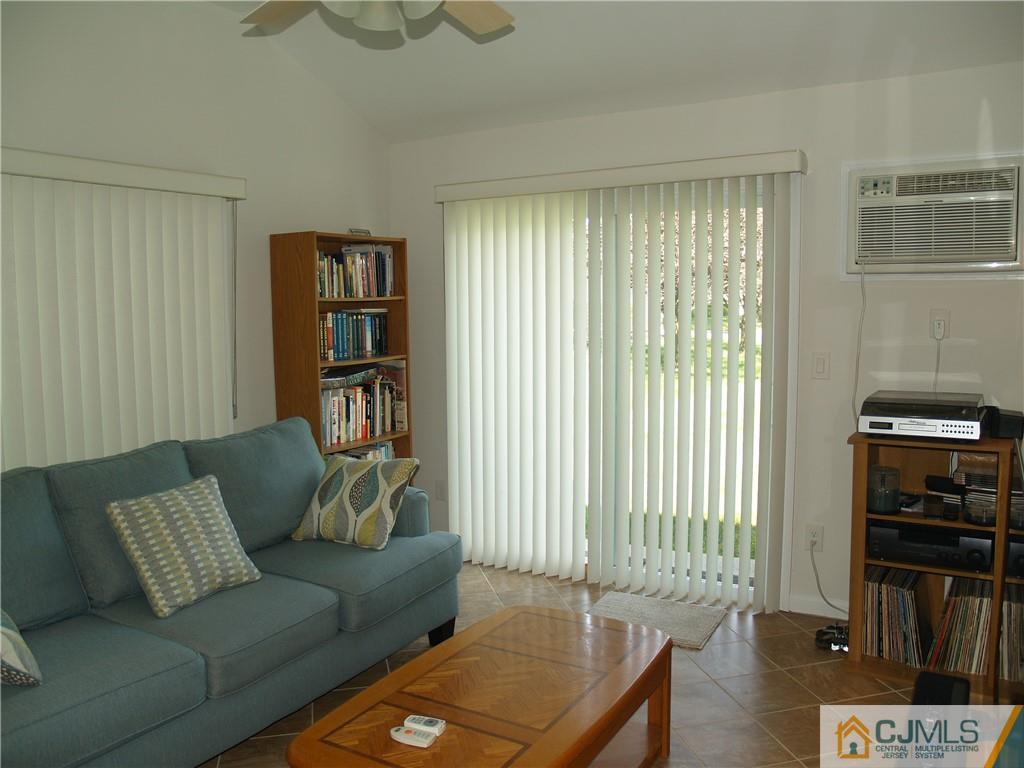 504 A Belford Road, Unit A Monroe Township, NJ 08831 - Photo 22 of 42 a living room with furniture and a window