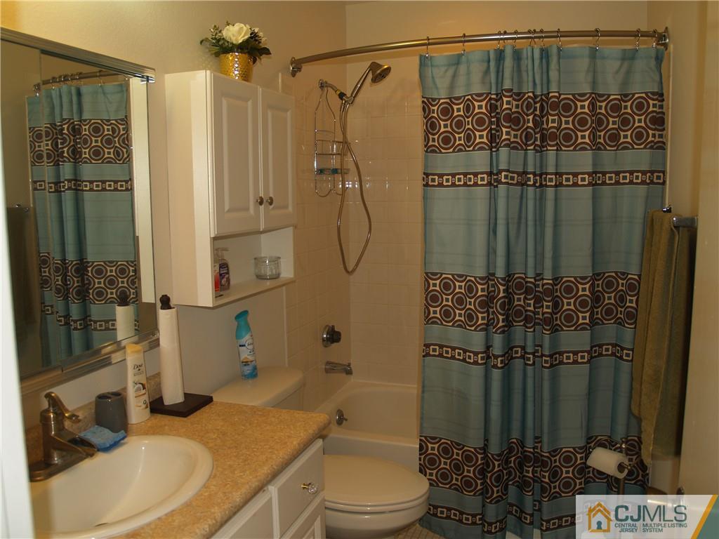 504 A Belford Road, Unit A Monroe Township, NJ 08831 - Photo 27 of 42 a bathroom with a sink toilet and shower