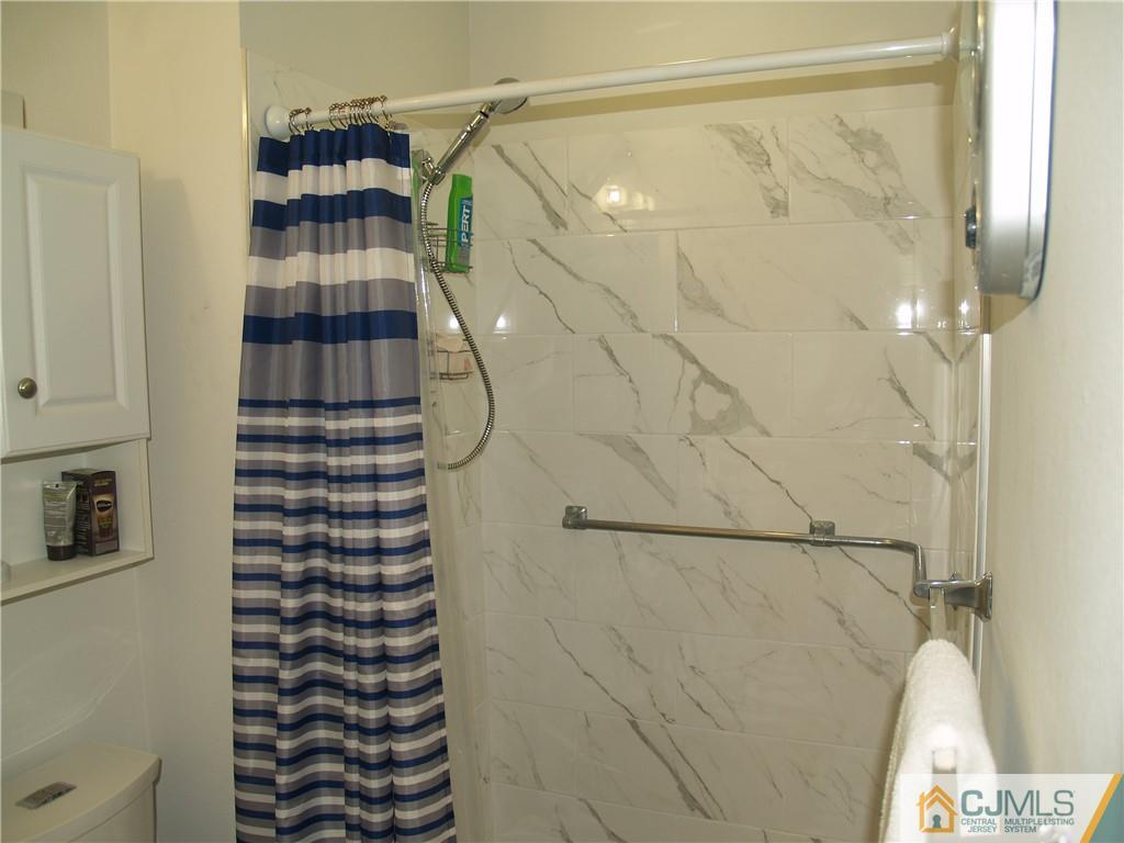 504 A Belford Road, Unit A Monroe Township, NJ 08831 - Photo 30 of 42 a bathroom with a shower