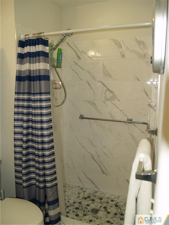 504 A Belford Road, Unit A Monroe Township, NJ 08831 - Photo 31 of 42 a bathroom with a shower and a toilet