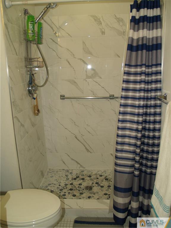 504 A Belford Road, Unit A Monroe Township, NJ 08831 - Photo 32 of 42 a bathroom with a toilet and a shower