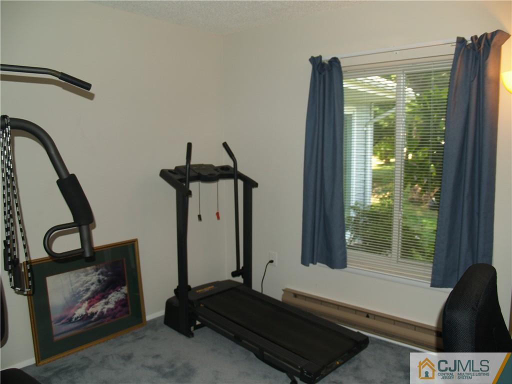 504 A Belford Road, Unit A Monroe Township, NJ 08831 - Photo 37 of 42 a room with gym equipment and a large window