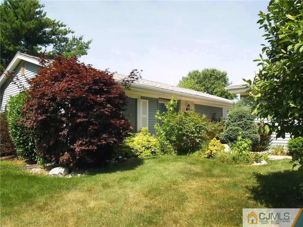 504 A Belford Road, Unit A Monroe Township, NJ 08831 - Photo 40 of 42 a house with a tree in front of it