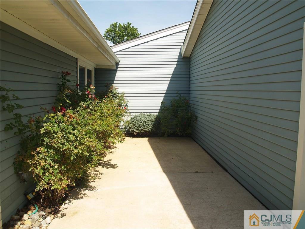 504 A Belford Road, Unit A Monroe Township, NJ 08831 - Photo 4 of 42 a view of a pathway with a house