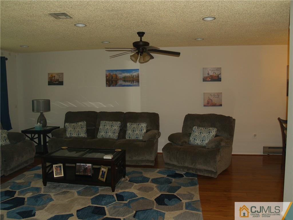 504 A Belford Road, Unit A Monroe Township, NJ 08831 - Photo 7 of 42 a living room with furniture and a rug