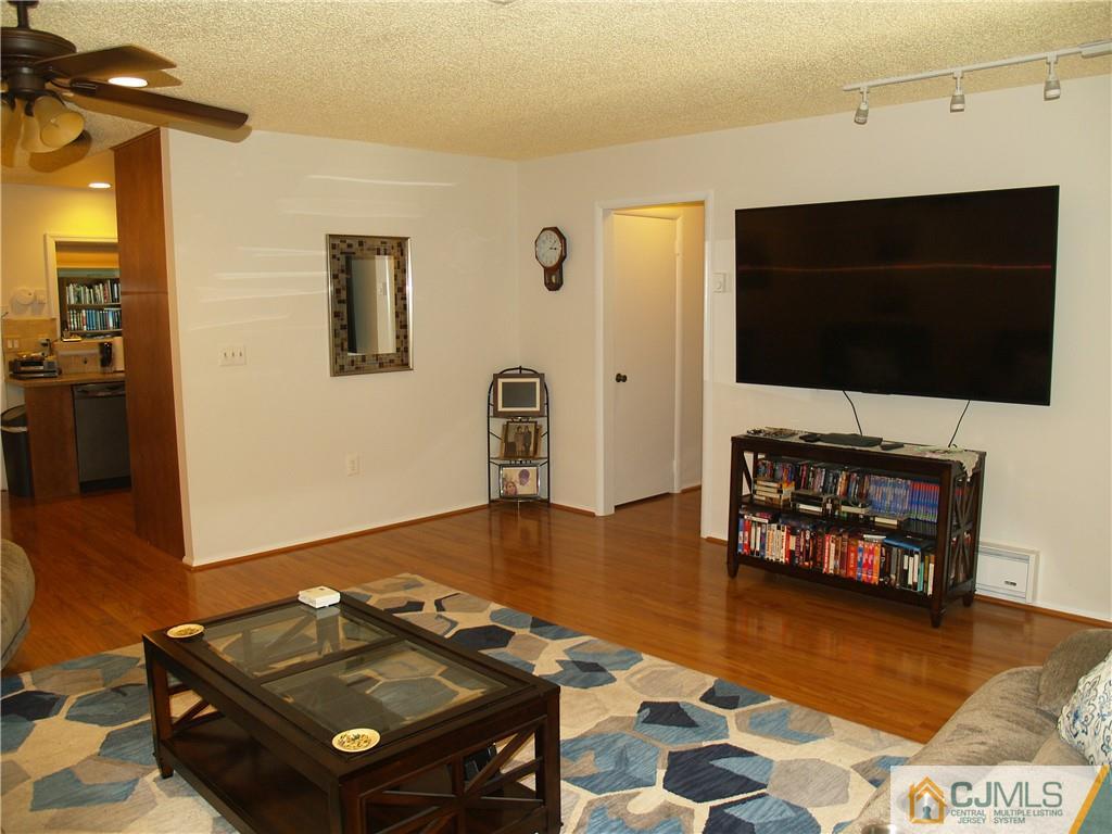 504 A Belford Road, Unit A Monroe Township, NJ 08831 - Photo 8 of 42 a living room with furniture and a flat screen tv