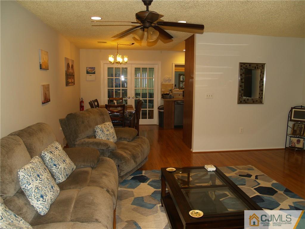 504 A Belford Road, Unit A Monroe Township, NJ 08831 - Photo 10 of 42 a living room with furniture and a flat screen tv