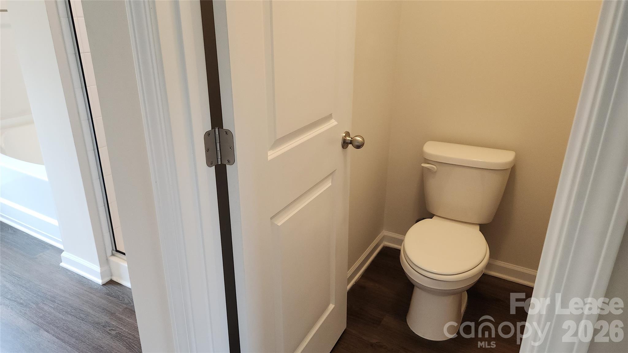 14320 Moss Road Charlotte, NC 28273 - Photo 12 of 22 a white toilet sitting next to a sink