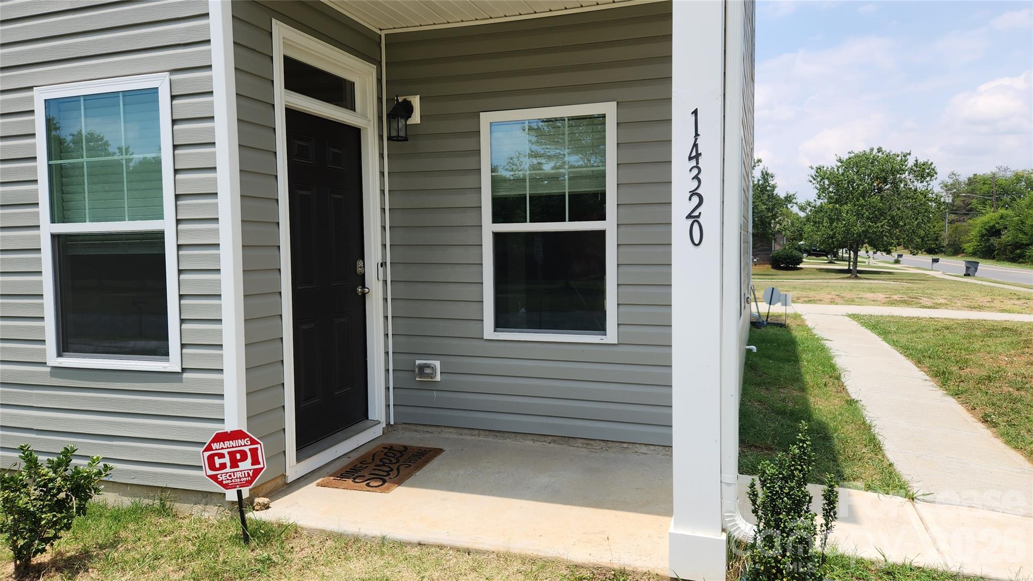 14320 Moss Road Charlotte, NC 28273 - Photo 2 of 22 a front view of a house with outdoor space