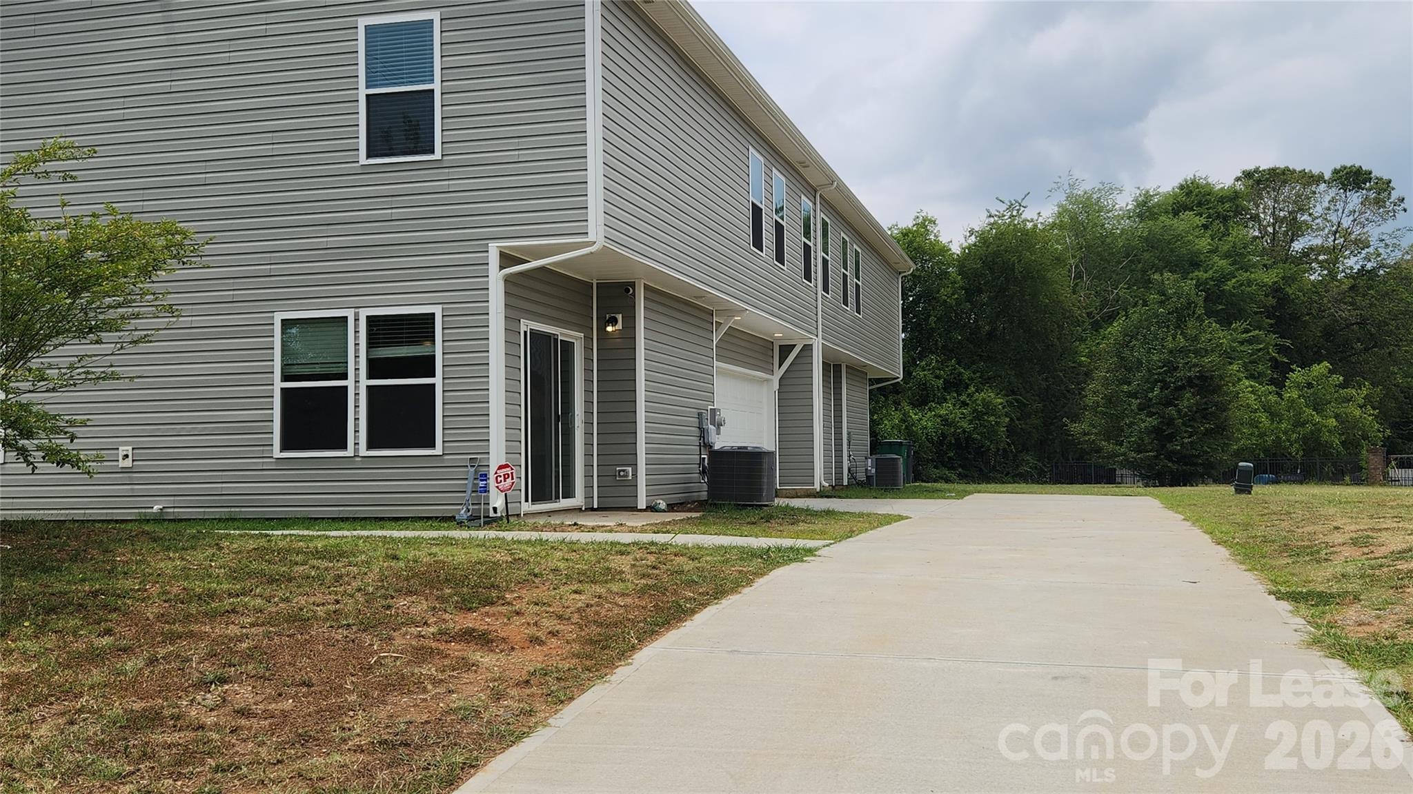 14320 Moss Road Charlotte, NC 28273 - Photo 22 of 22 a front view of a house with a yard