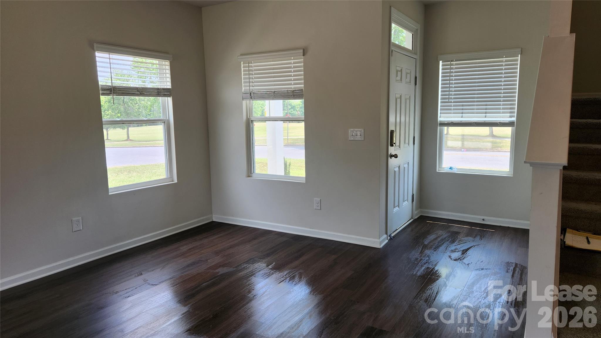 14320 Moss Road Charlotte, NC 28273 - Photo 8 of 22 a view of an empty room with wooden floor and a window