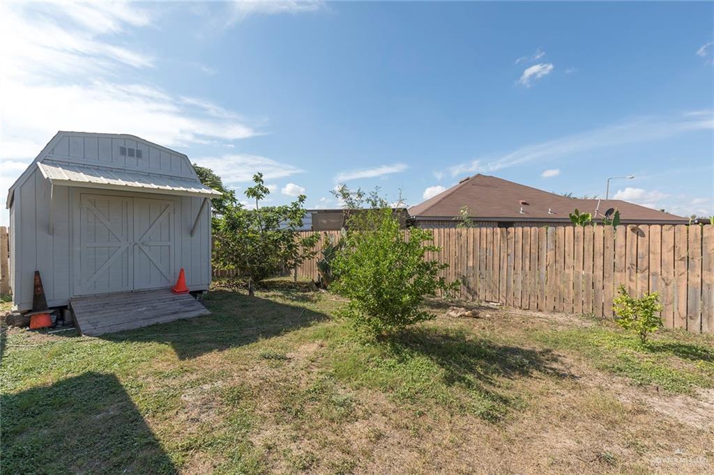 706 South 19th Street Hidalgo, TX 78557 - Photo 17 of 18 a backyard of a house with lots of green space