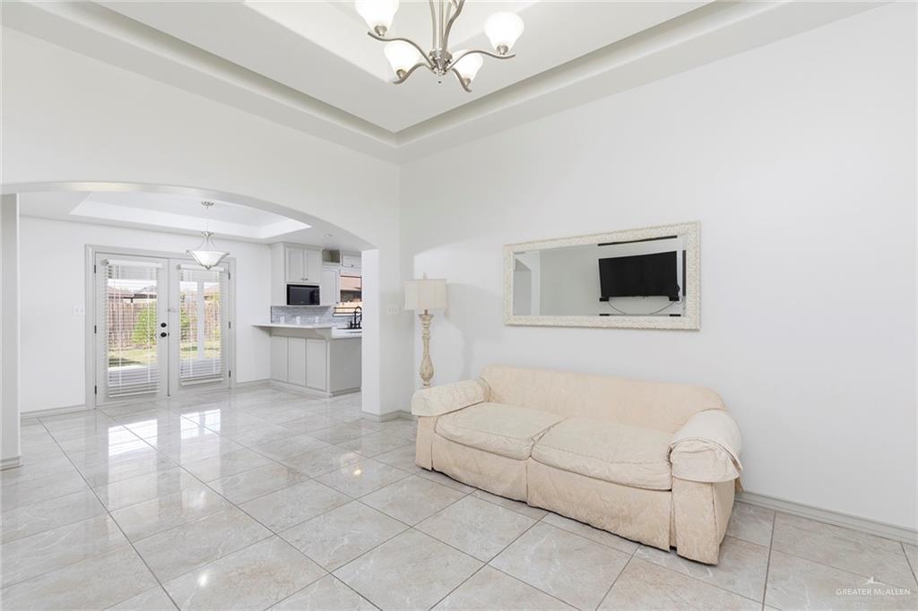 706 South 19th Street Hidalgo, TX 78557 - Photo 9 of 18 a living room with furniture and a kitchen view