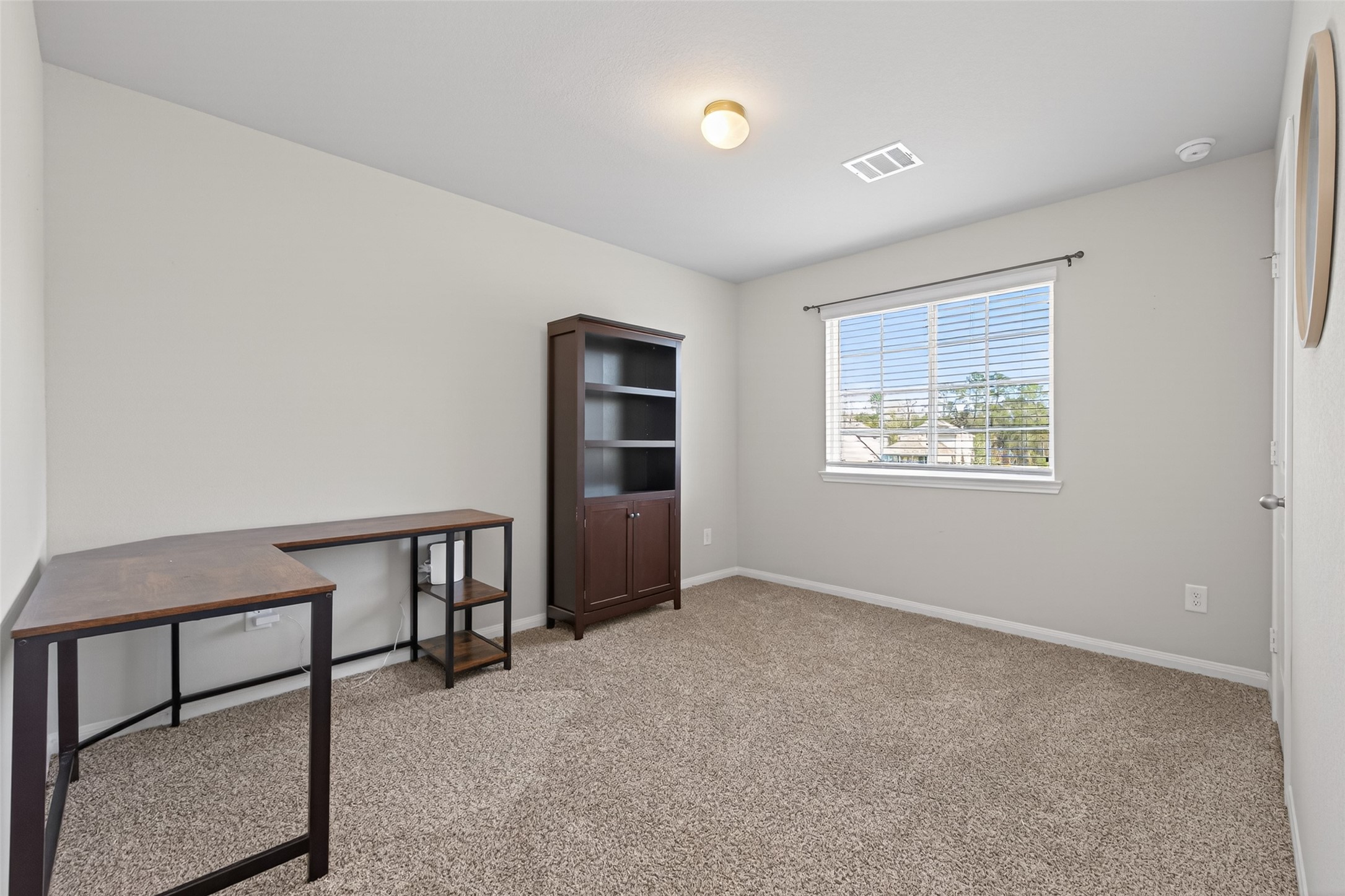 2354 Raider Drive Conroe, TX 77301 - Photo 15 of 20 a view of workspace room with window