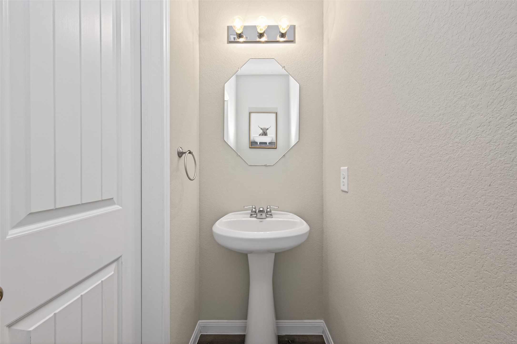 2354 Raider Drive Conroe, TX 77301 - Photo 17 of 20 a bathroom with a sink and a mirror