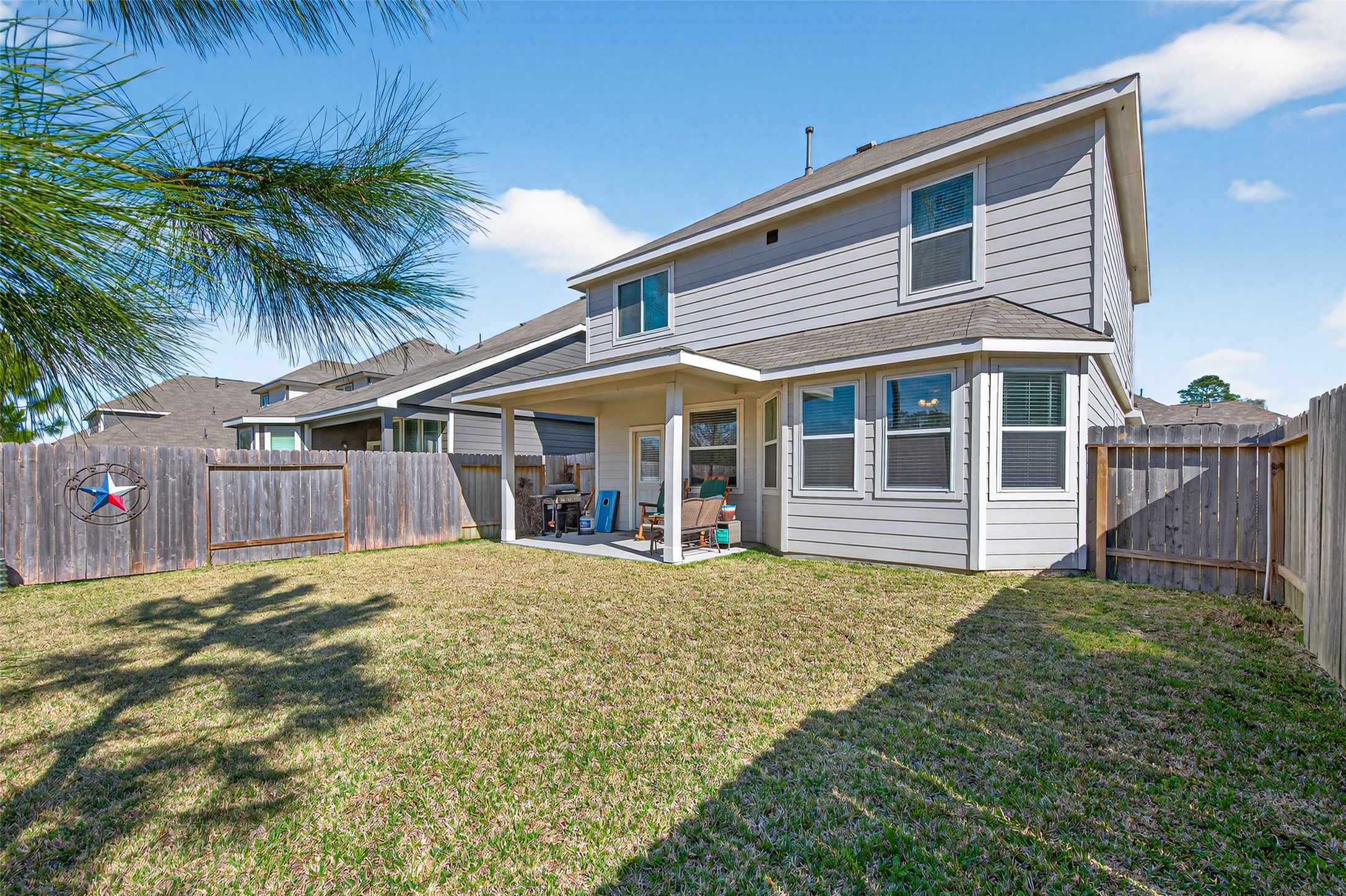 2354 Raider Drive Conroe, TX 77301 - Photo 19 of 20 a front view of a house with a garden