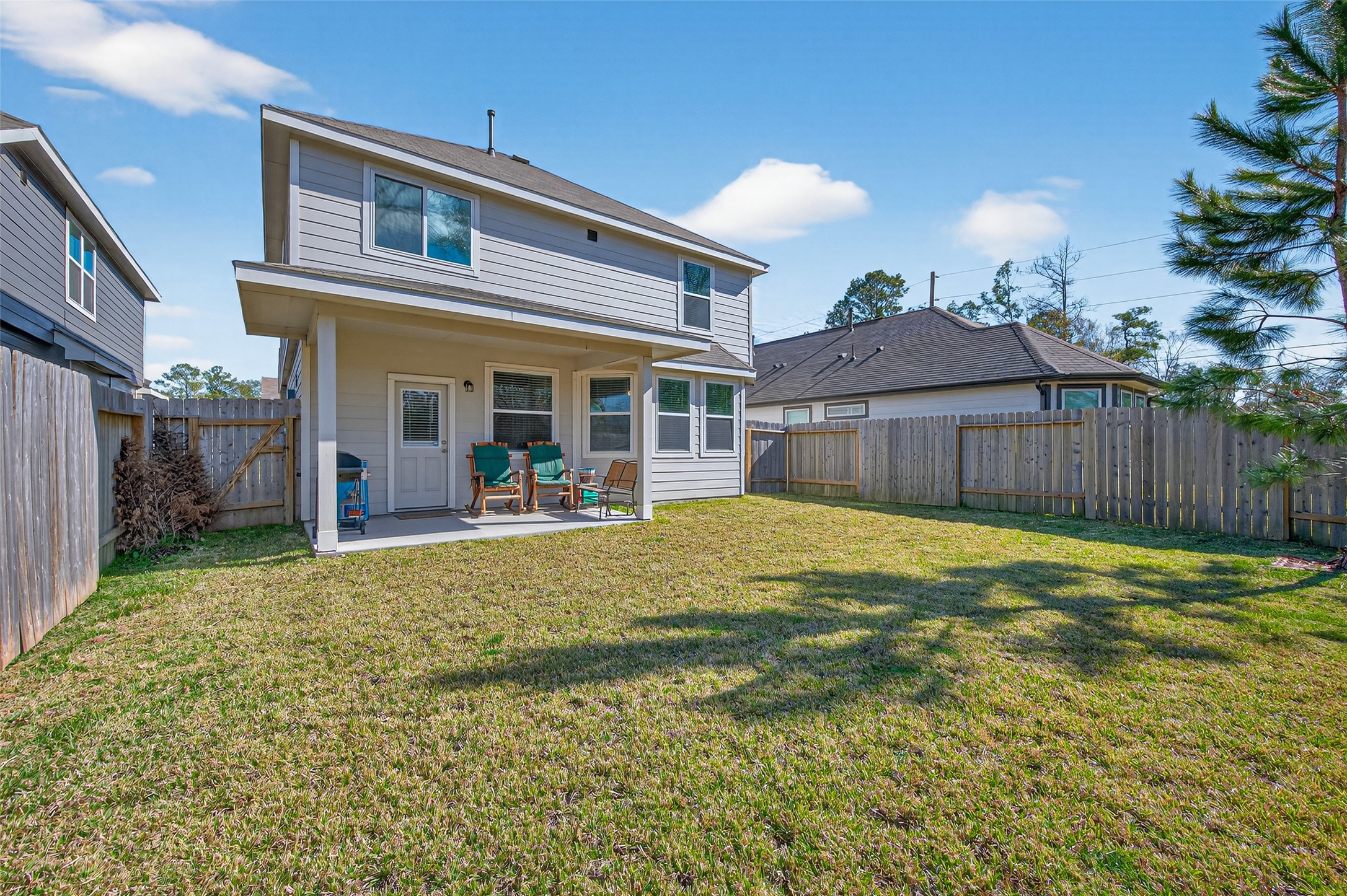 2354 Raider Drive Conroe, TX 77301 - Photo 20 of 20 a view of a house with backyard and a patio