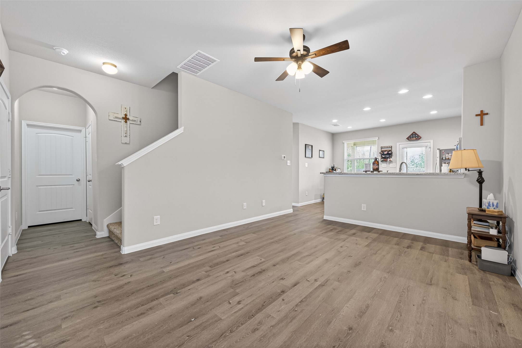 2354 Raider Drive Conroe, TX 77301 - Photo 2 of 20 a view of a livingroom with furniture wooden floor and a ceiling fan