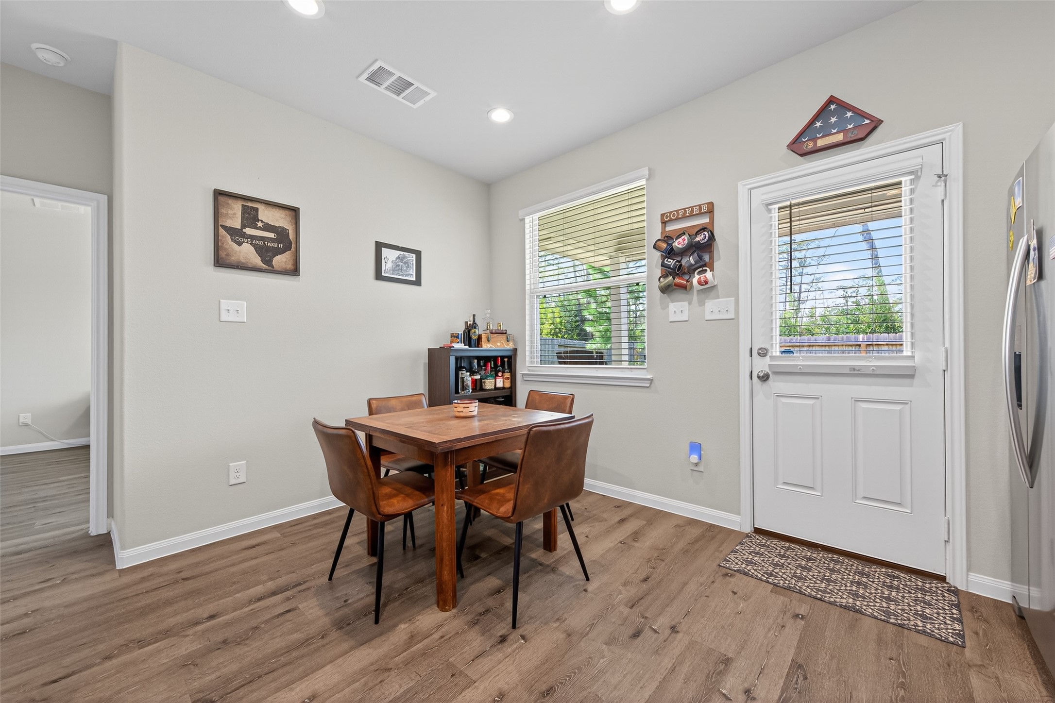 2354 Raider Drive Conroe, TX 77301 - Photo 6 of 20 a view of a dining room with furniture and a window