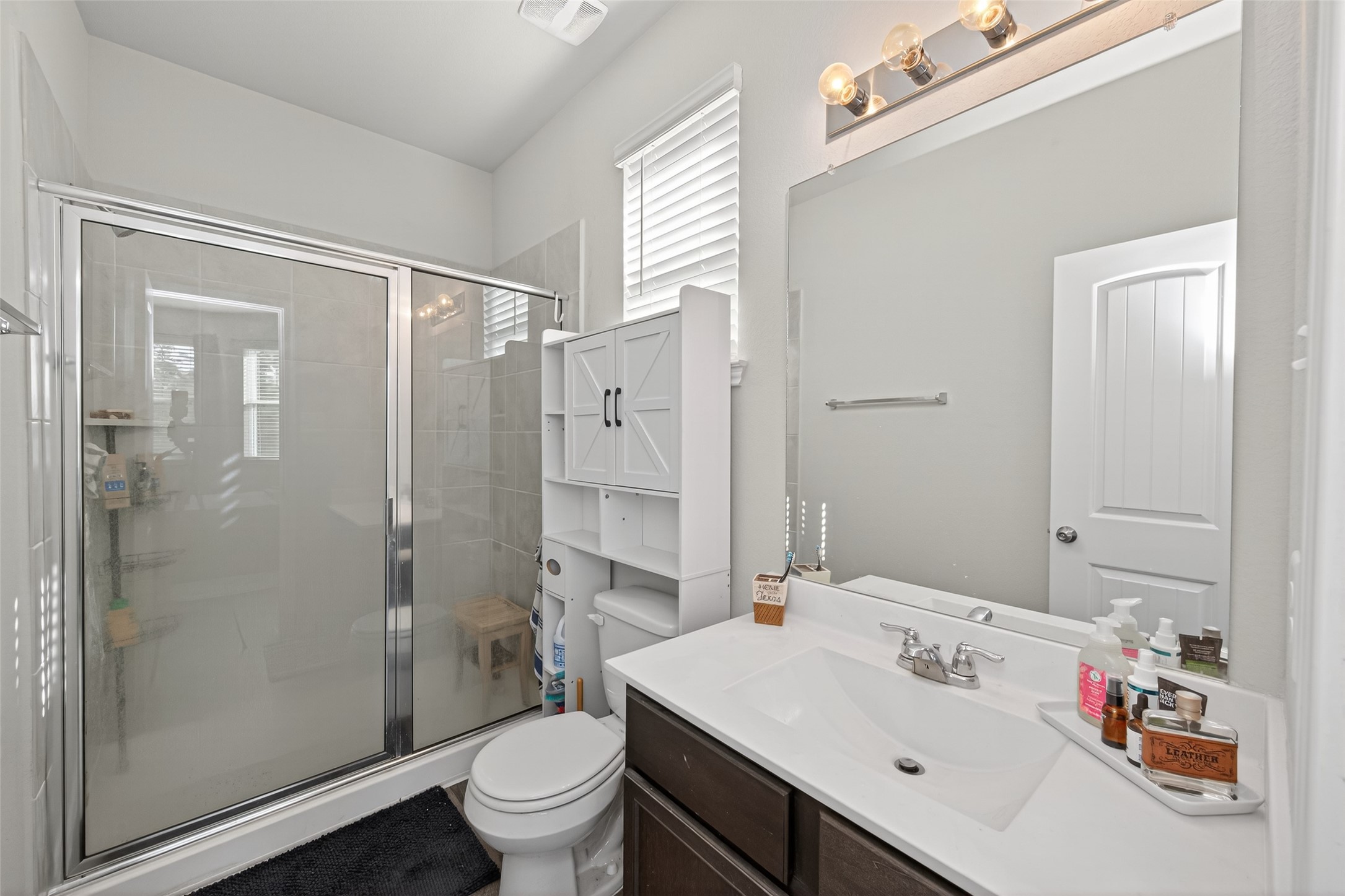2354 Raider Drive Conroe, TX 77301 - Photo 8 of 20 a bathroom with a sink toilet and shower