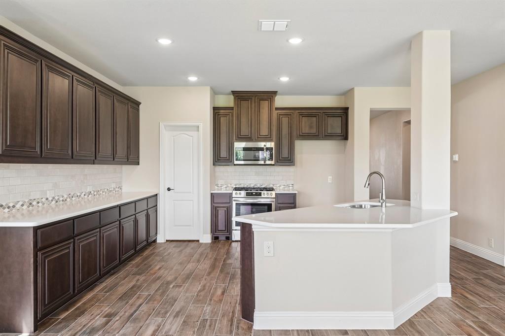 1228 Abbeygreen Road Forney, TX 75126 - Photo 3 of 31 Open concept kitchen