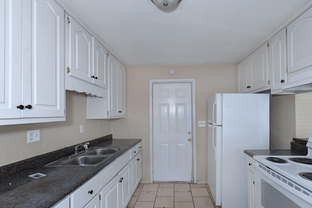 2946 Gleason Avenue Columbus, GA 31907 - Photo 3 of 17 a kitchen that has a sink and a stove