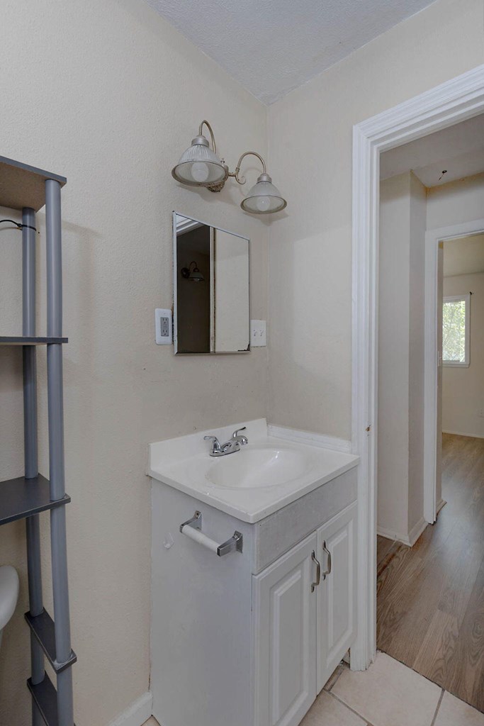 2946 Gleason Avenue Columbus, GA 31907 - Photo 7 of 17 a bathroom with a sink and a mirror