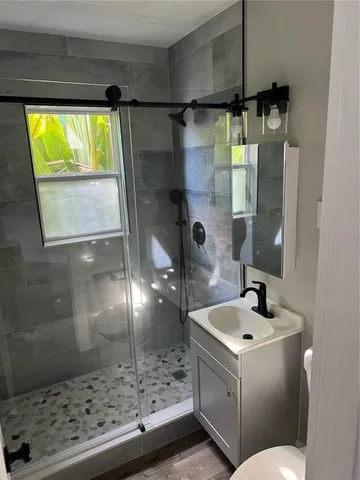 a bathroom with a sink and mirror