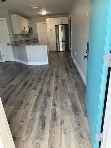 a view of a kitchen with a sink
