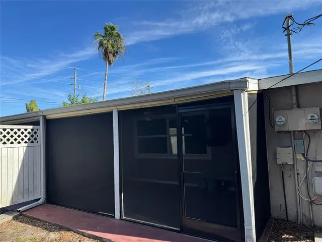 a potted plant sitting in front of a door
