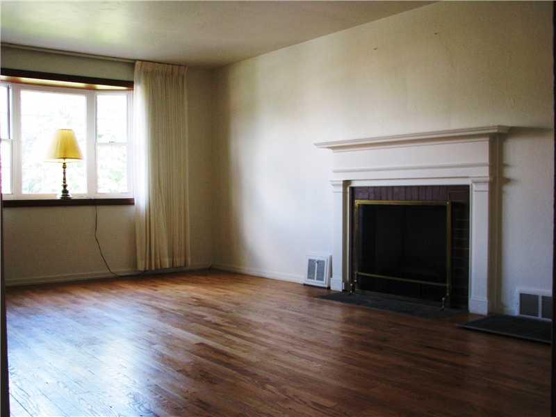 5314 Highgrove Road Whitehall, PA 15234 - Photo 2 of 20 Living Room. Exposed hardwood floor and log burning fireplace in the Living Room