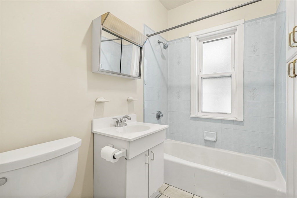 36 Windsor Road, Unit 2 Somerville, MA 02144 - Photo 17 of 26 a bathroom with a sink a toilet and shower