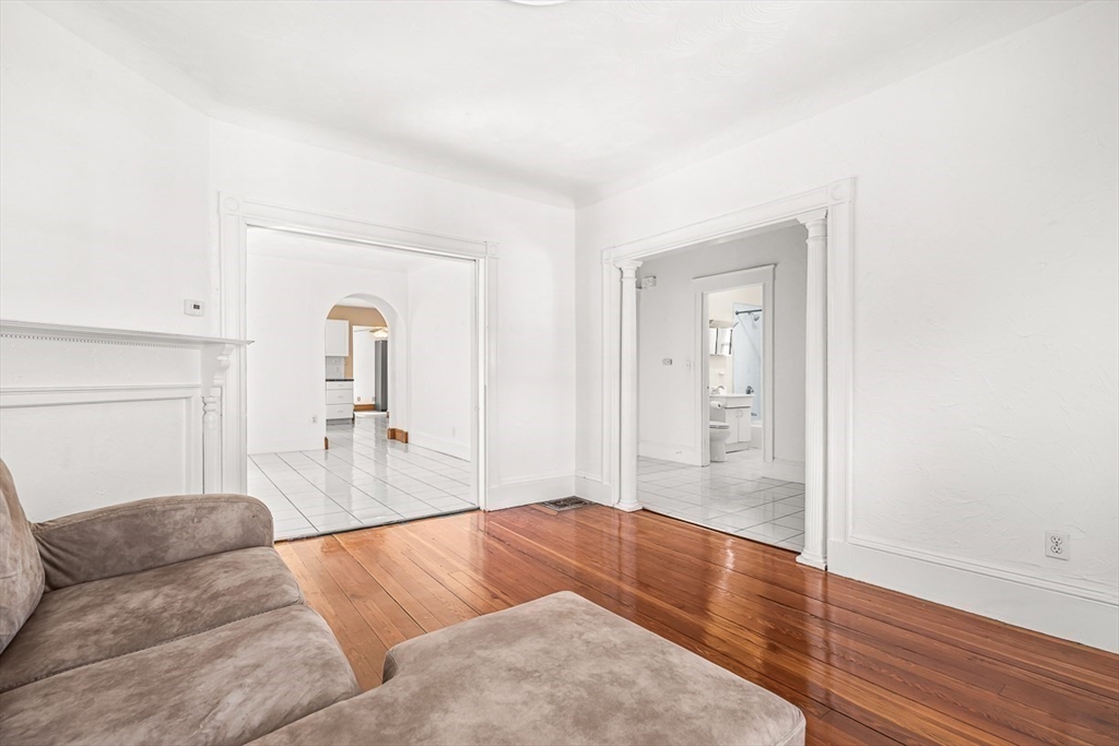 36 Windsor Road, Unit 2 Somerville, MA 02144 - Photo 19 of 26 a living room with furniture and wooden floor