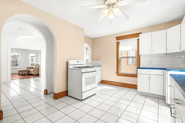 a kitchen with a stove a sink and a refrigerator