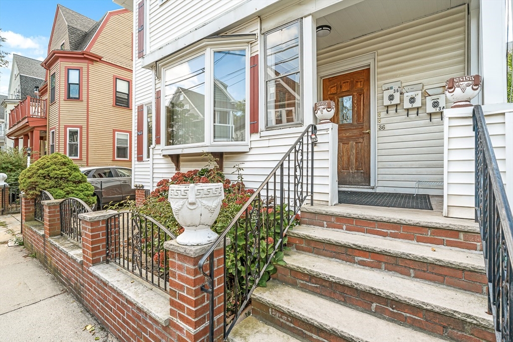 36 Windsor Road, Unit 2 Somerville, MA 02144 - Photo 23 of 26 a view of a chair and table in the balcony