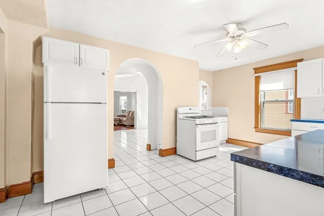 a kitchen with a refrigerator and a sink