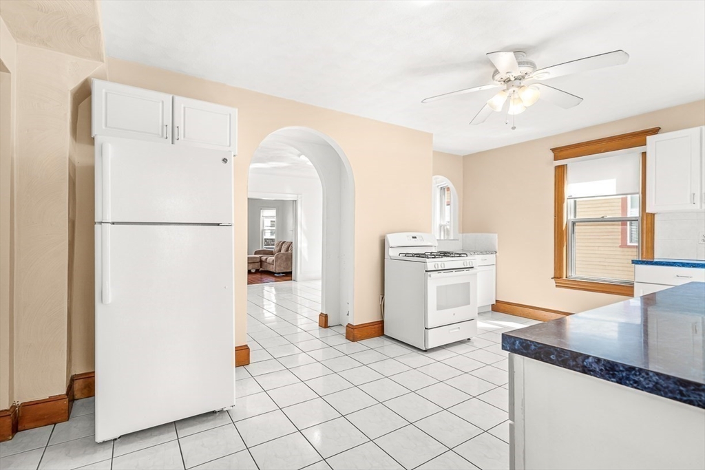 36 Windsor Road, Unit 2 Somerville, MA 02144 - Photo 3 of 26 a kitchen with a refrigerator and a sink
